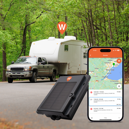 XTracker Solar GPS tracker with solar panel, displayed alongside a smartphone showing the WhereSafe tracking app, with a background featuring a recreational vehicle and a pickup truck in a forest.
