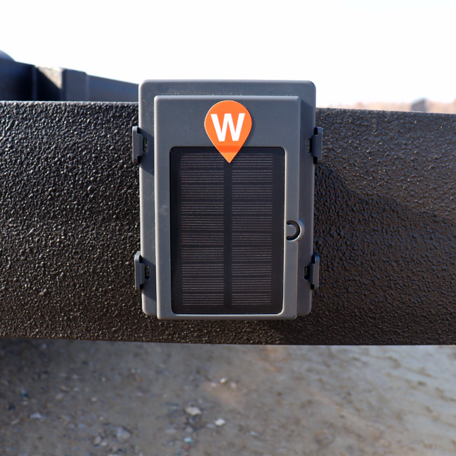 Xtracker Solar GPS tracker with integrated solar panel attached to trailer with magnetic mount.